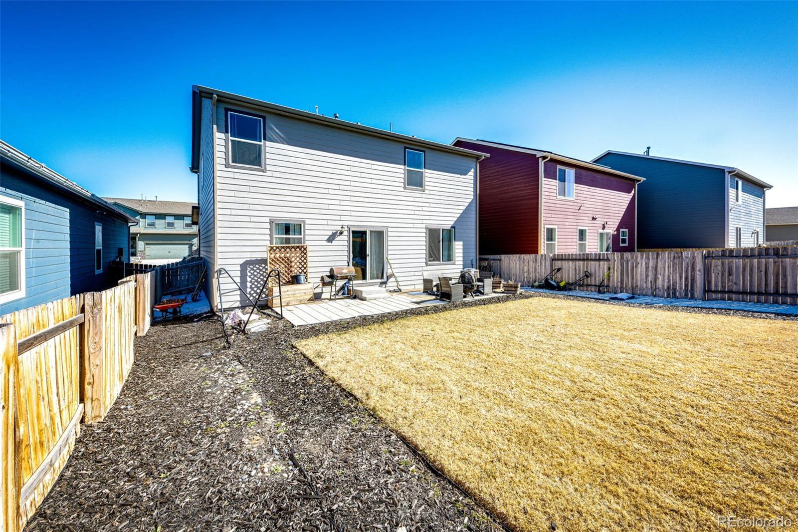 325 Walnut Street Bennett, CO 80102 - Photo 22 of 22 a view of a house with a swimming pool