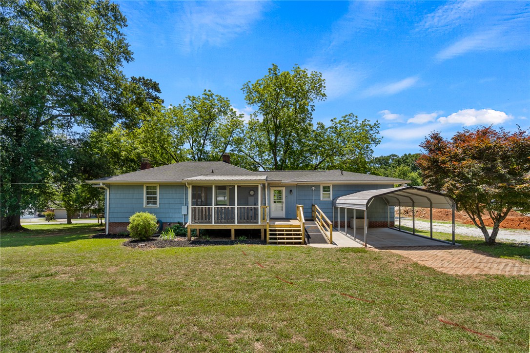 1509 869 Anderson, SC 29621 - Photo 42 of 45 A welcoming rear elevation with a spacious screened porch and convenient covered carport.