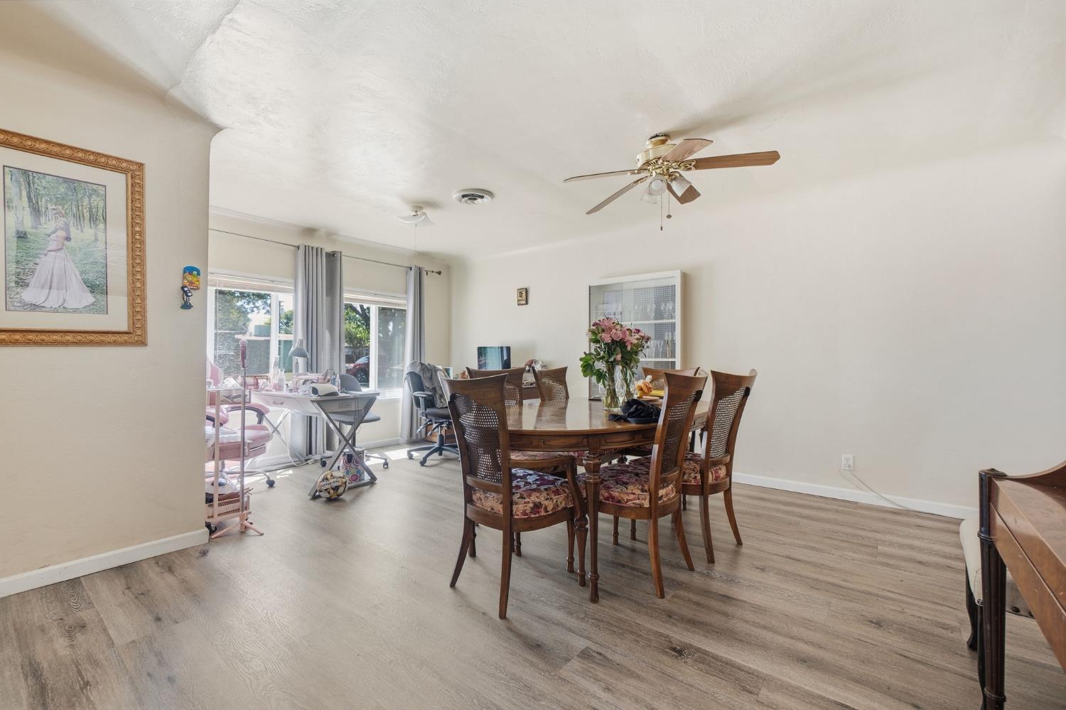 1705 Stetson Avenue Modesto, CA 95350 - Photo 7 of 32 a view of a dining room with furniture and wooden floor