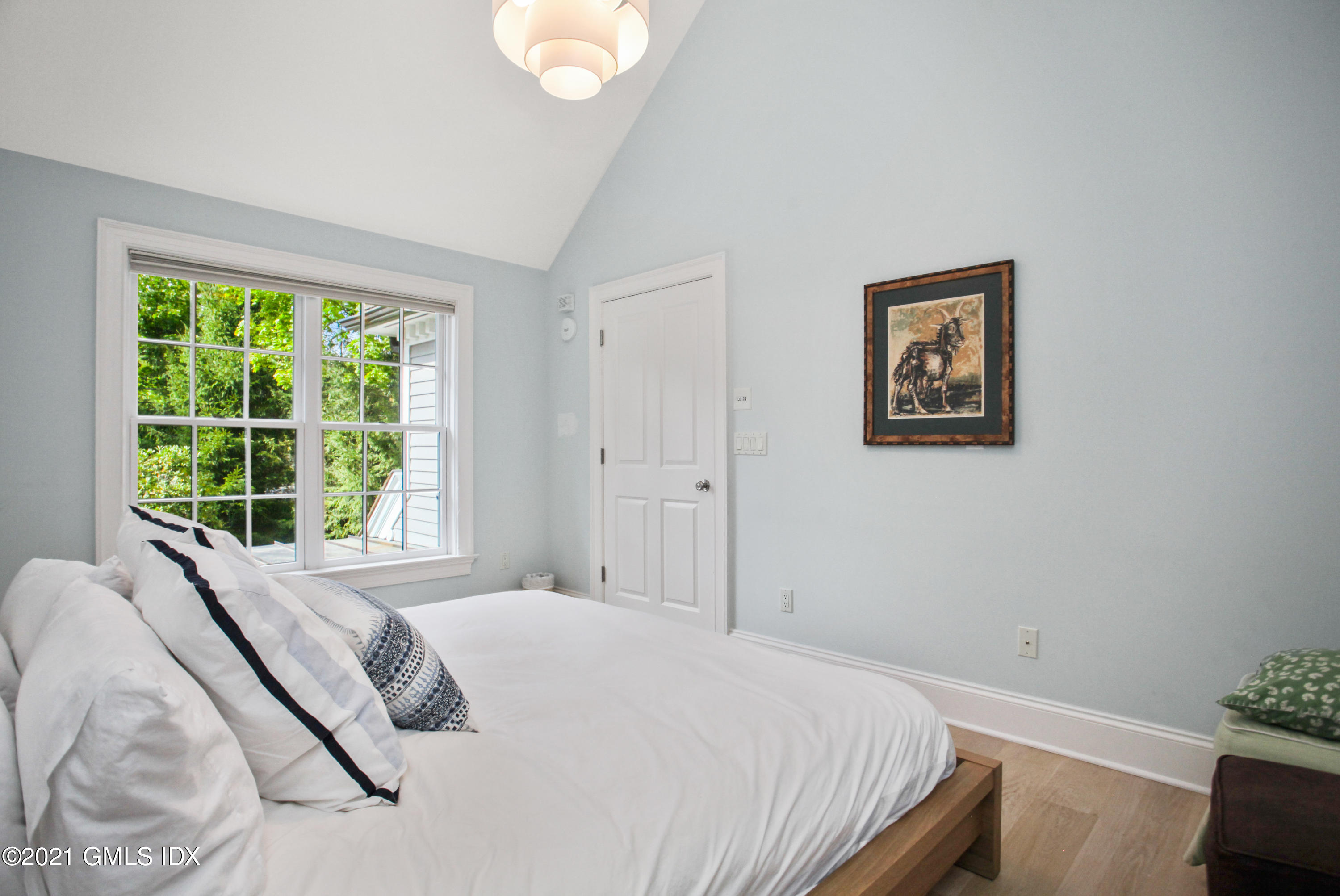 8 Cathlow Drive Riverside, CT 06878 - Photo 39 of 44 a bedroom with a bed and a painting on the wall