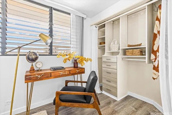 a bedroom with furniture and a window