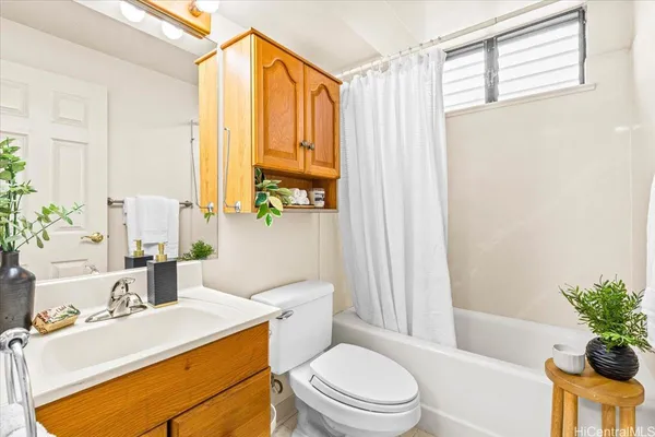 a bathroom with a sink a toilet and tub