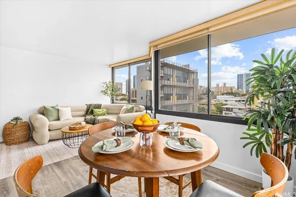 a living room with furniture and a large window
