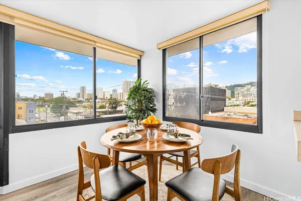 a dining room with furniture and window