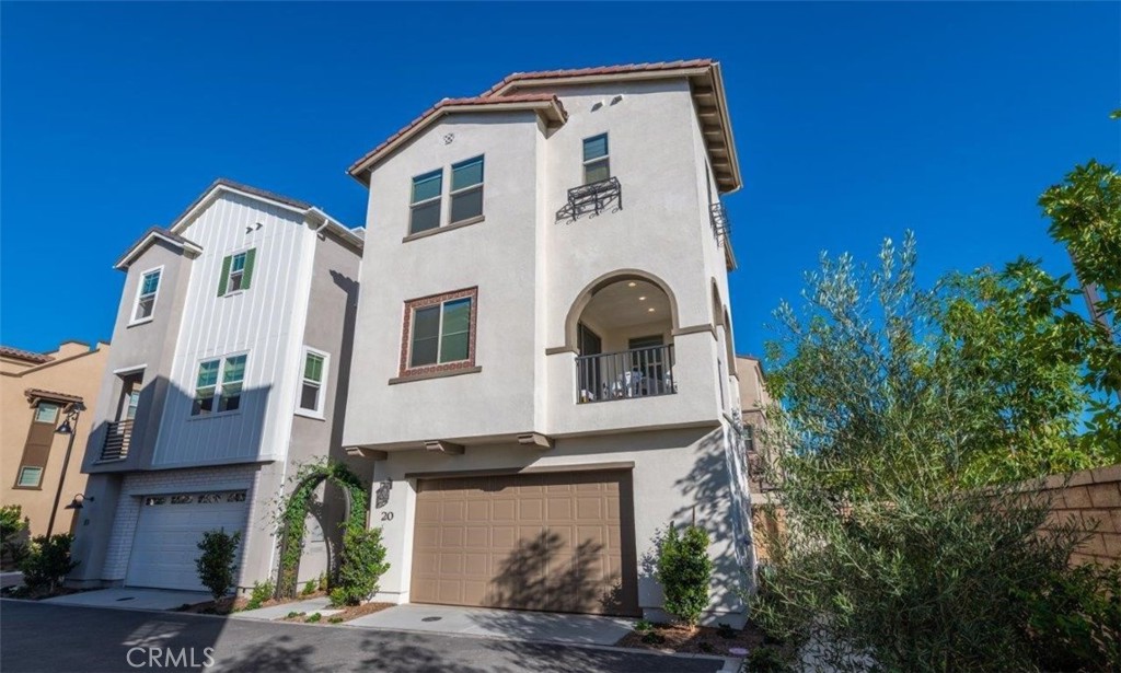 20 Hideaway Loop Mission Viejo, CA 92692 - Photo 1 of 1 a front view of a house with a yard