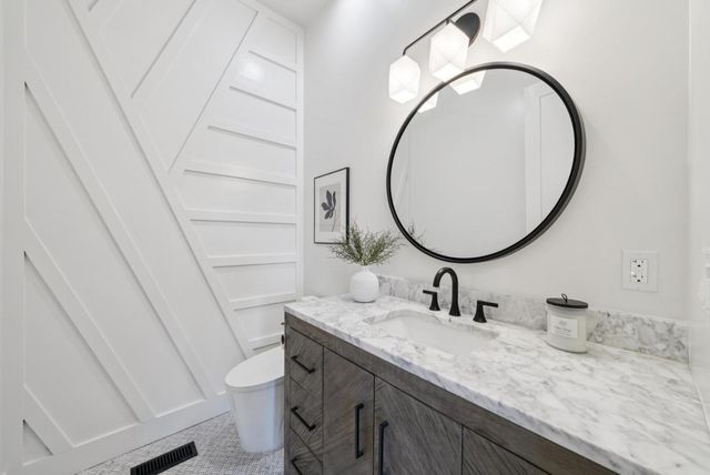 a utility room with sink dryer and washer