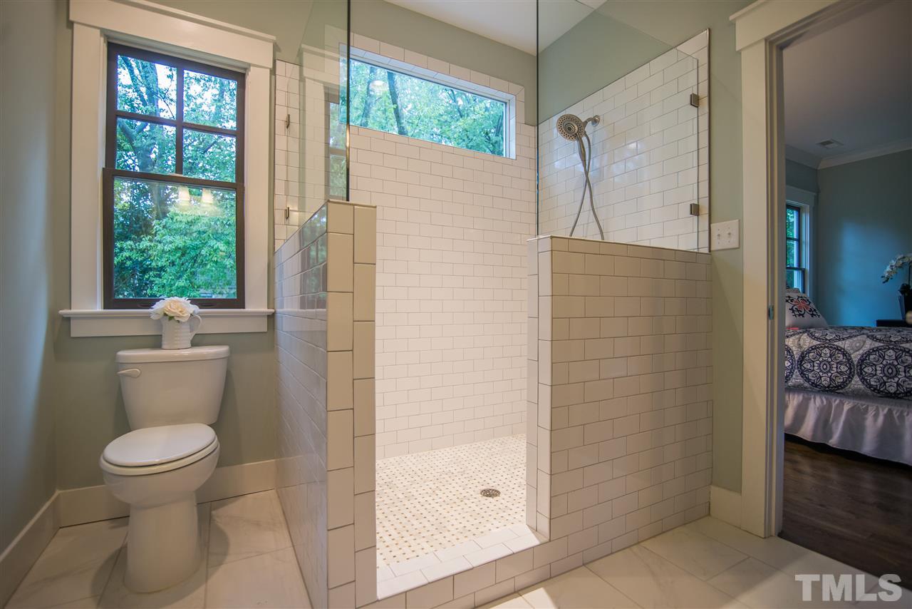 504 Freeman Street Raleigh, NC 27601 - Photo 14 of 20 a bathroom with a toilet and a shower