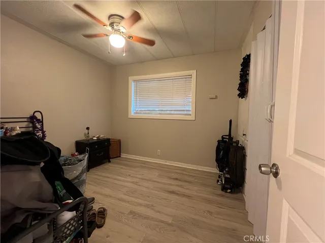 a view of workspace with wooden floor windows