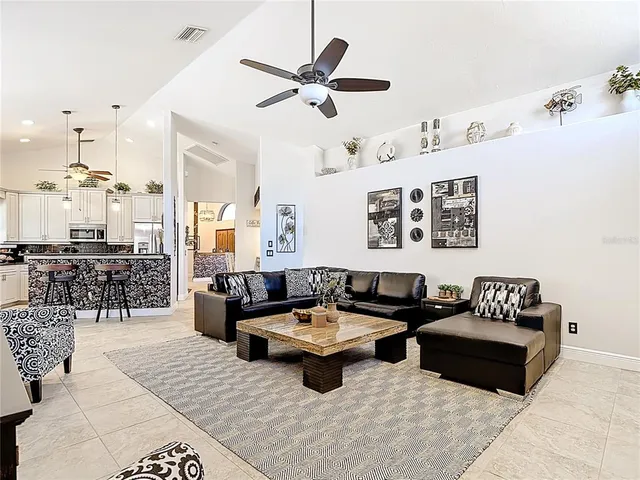 a view of a patio with table and chairs