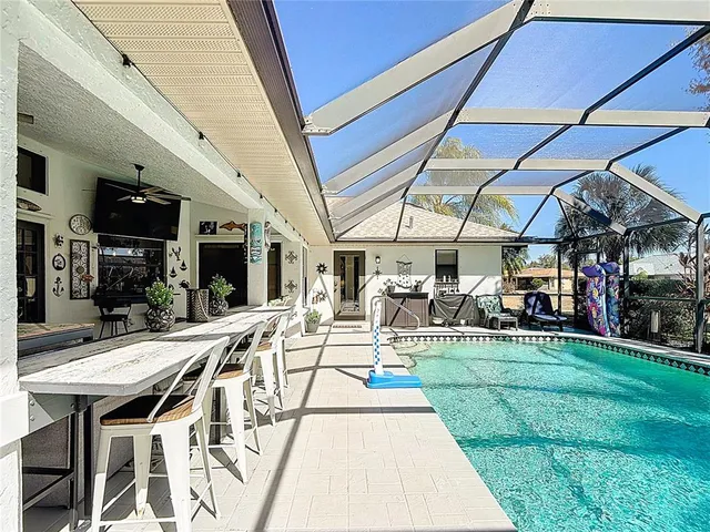 a living room with furniture a rug and a chandelier