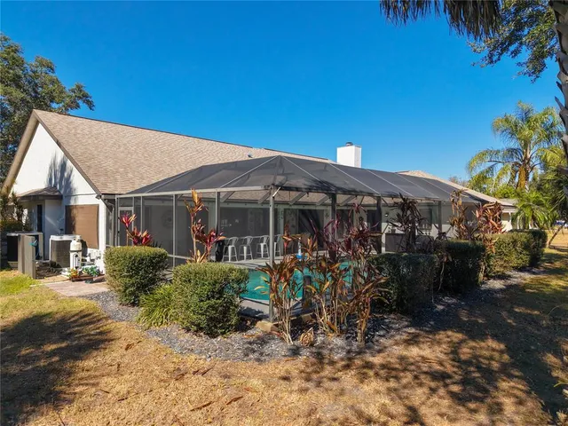 a bedroom with a bed and a chair