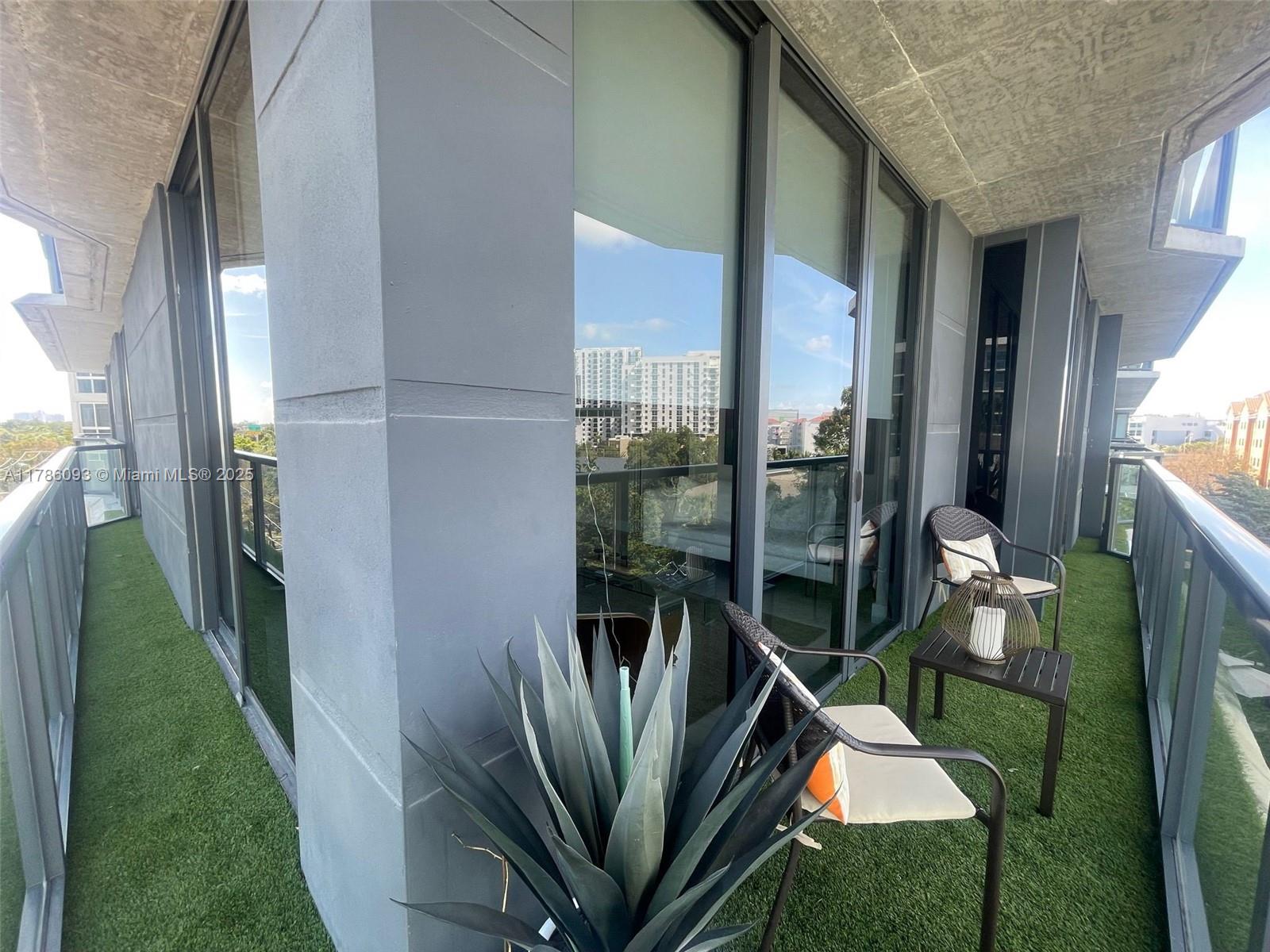 201 Southwest 17th Road, Unit 607 Miami, FL 33129 - Photo 16 of 31 a view of living room and floor to ceiling window