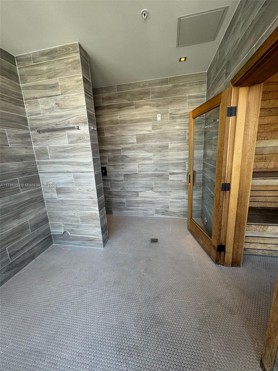 201 Southwest 17th Road, Unit 607 Miami, FL 33129 - Photo 22 of 31 a view of walk in closet with empty racks