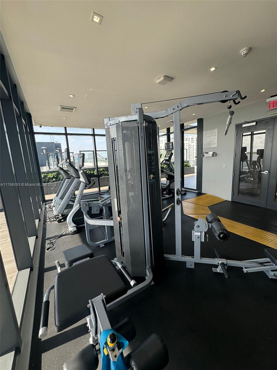 201 Southwest 17th Road, Unit 607 Miami, FL 33129 - Photo 25 of 31 a room with gym equipment and a table