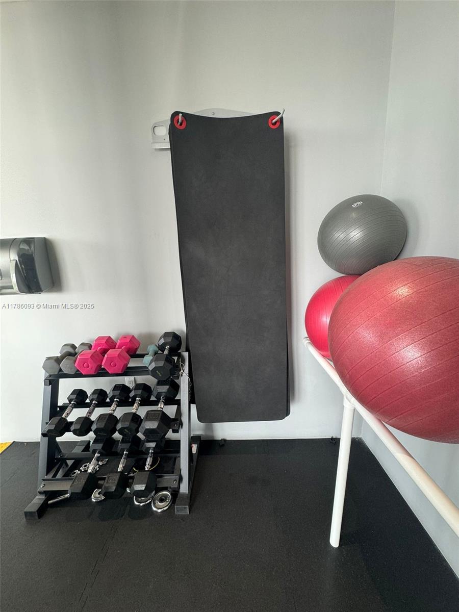 201 Southwest 17th Road, Unit 607 Miami, FL 33129 - Photo 26 of 31 a room with gym equipment