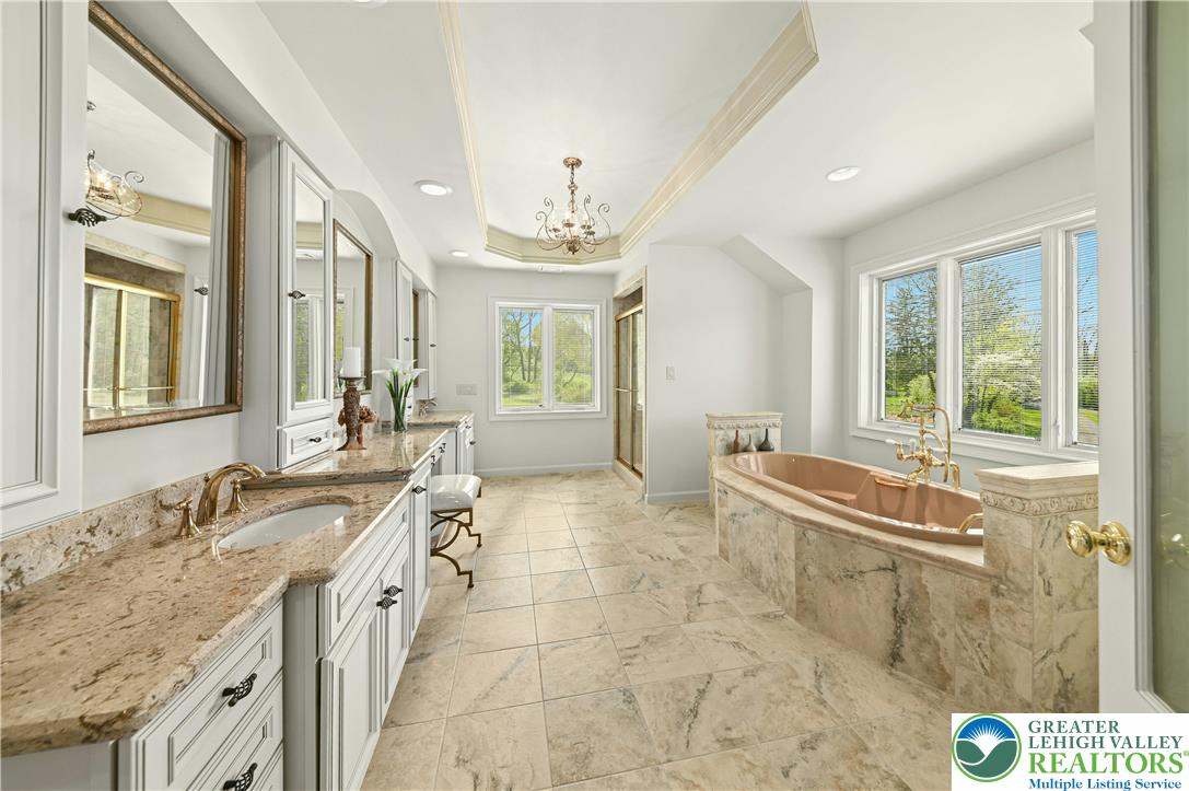 3200 Creamery Road New Hope, PA 18938 - Photo 26 of 42 a spacious bathroom with a tub sink and mirror
