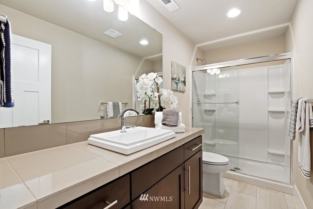 15 176th Place Southwest Bothell, WA 98012 - Photo 22 of 39 a bathroom with a sink a toilet and shower