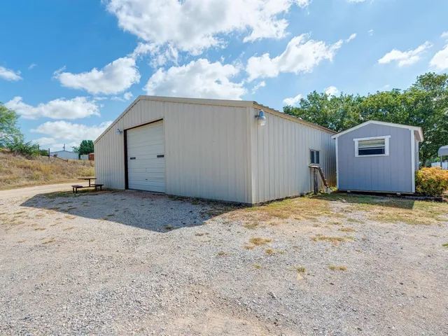 a view of a backyard of the house