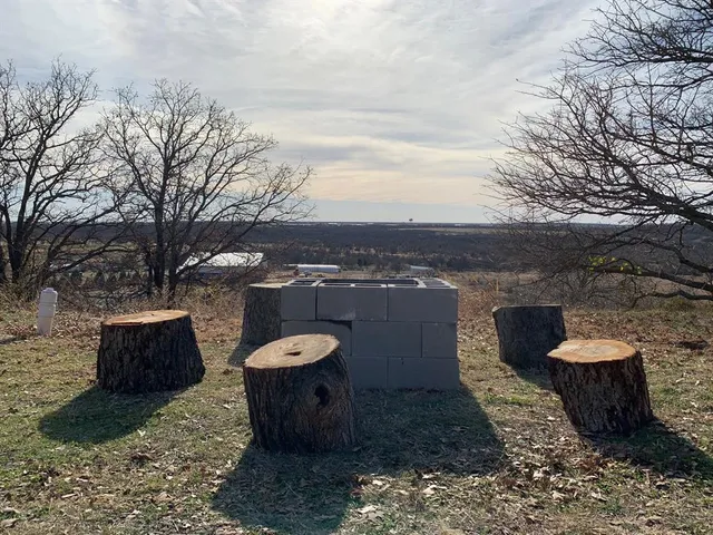 a view of a backyard with sitting area