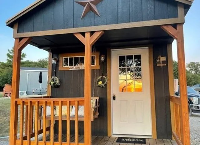 a front view of a house with glass windows