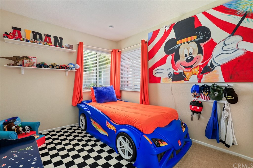 27002 Lightfoot Drive Corona, CA 92883 - Photo 13 of 31 a bedroom with a bed and a window