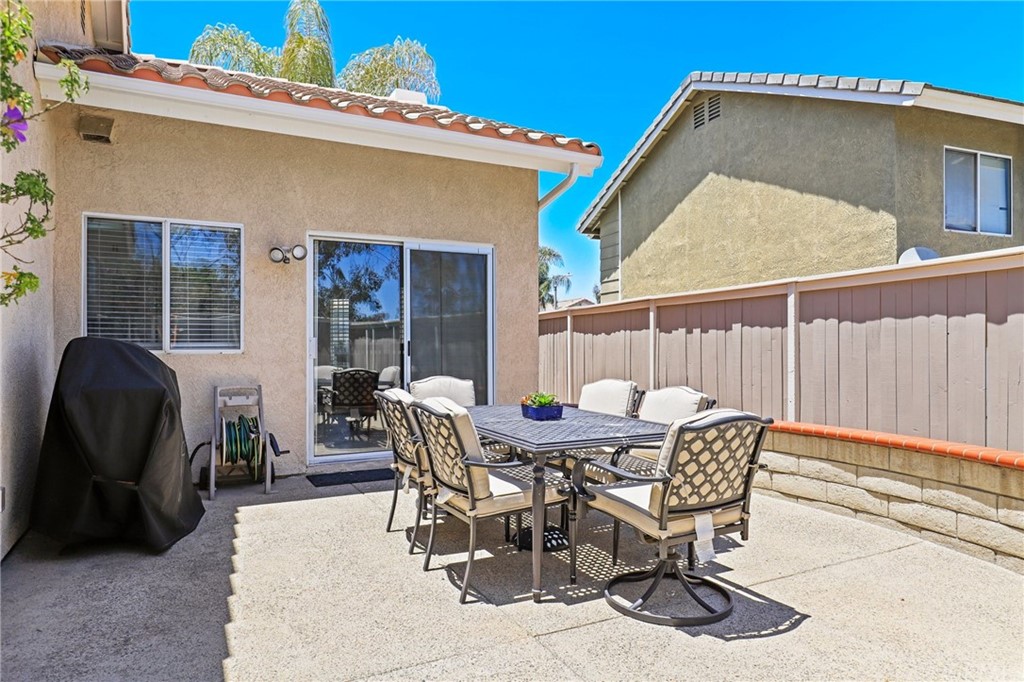 27002 Lightfoot Drive Corona, CA 92883 - Photo 21 of 31 a view of a patio with a table and chairs