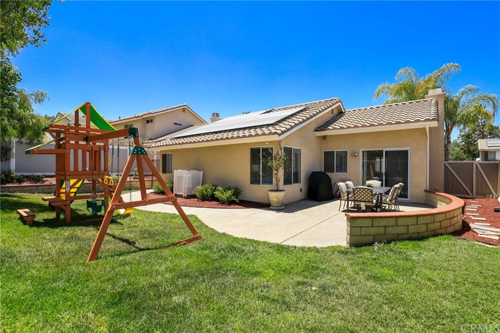 27002 Lightfoot Drive Corona, CA 92883 - Photo 23 of 31 a view of a house with backyard sitting area and swimming pool