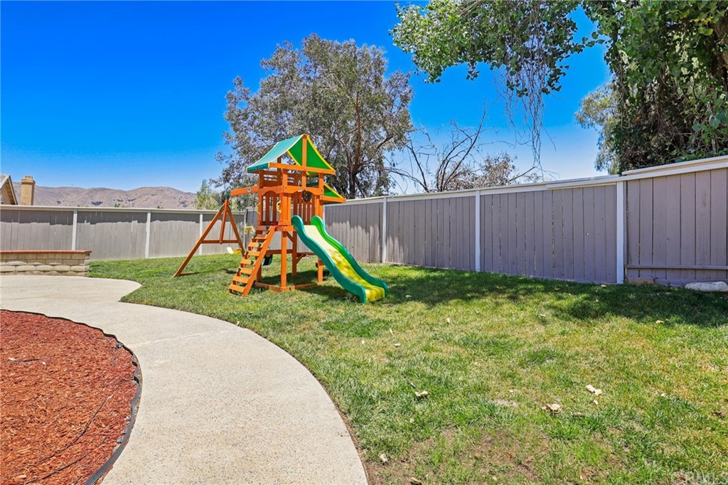 27002 Lightfoot Drive Corona, CA 92883 - Photo 24 of 31 a view of a backyard with a slide