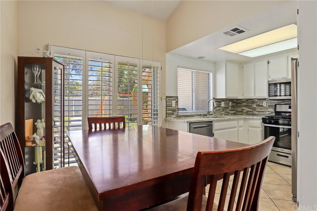 27002 Lightfoot Drive Corona, CA 92883 - Photo 8 of 31 a dining room with furniture and window