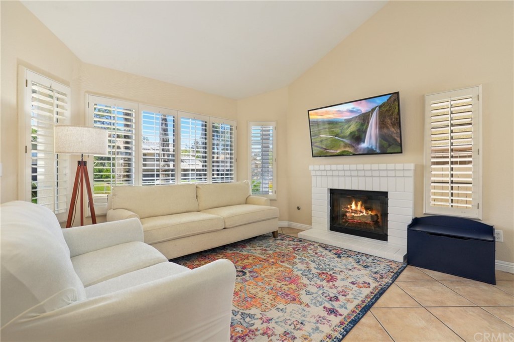 27002 Lightfoot Drive Corona, CA 92883 - Photo 9 of 31 a living room with furniture and a fireplace