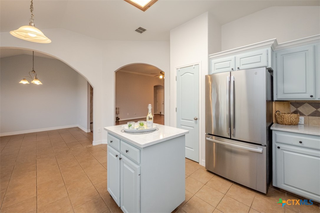 124 Prairie Circle Kempner, TX 76539 - Photo 17 of 34 a kitchen with stainless steel appliances a refrigerator and a sink