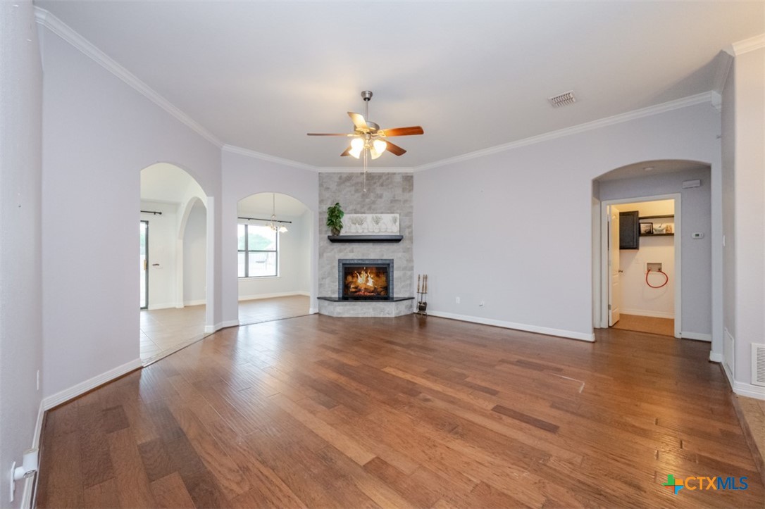 124 Prairie Circle Kempner, TX 76539 - Photo 18 of 34 a view of an empty room with window and wooden floor