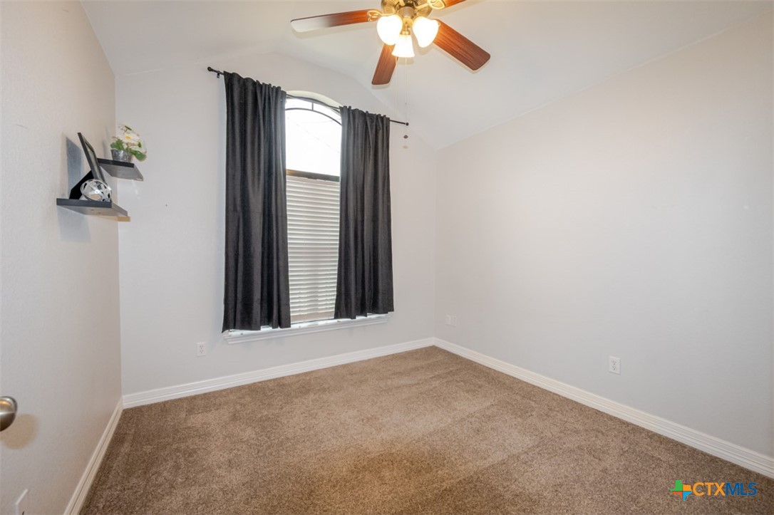 124 Prairie Circle Kempner, TX 76539 - Photo 24 of 34 an empty room with windows and fan