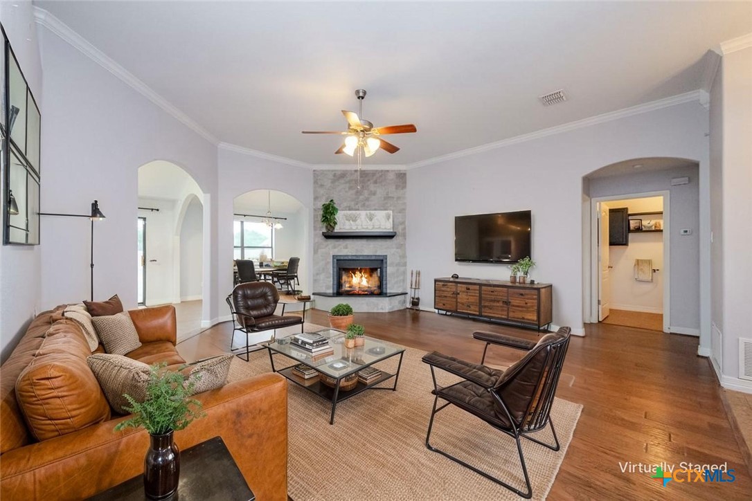 124 Prairie Circle Kempner, TX 76539 - Photo 3 of 34 a living room with fireplace furniture and a flat screen tv