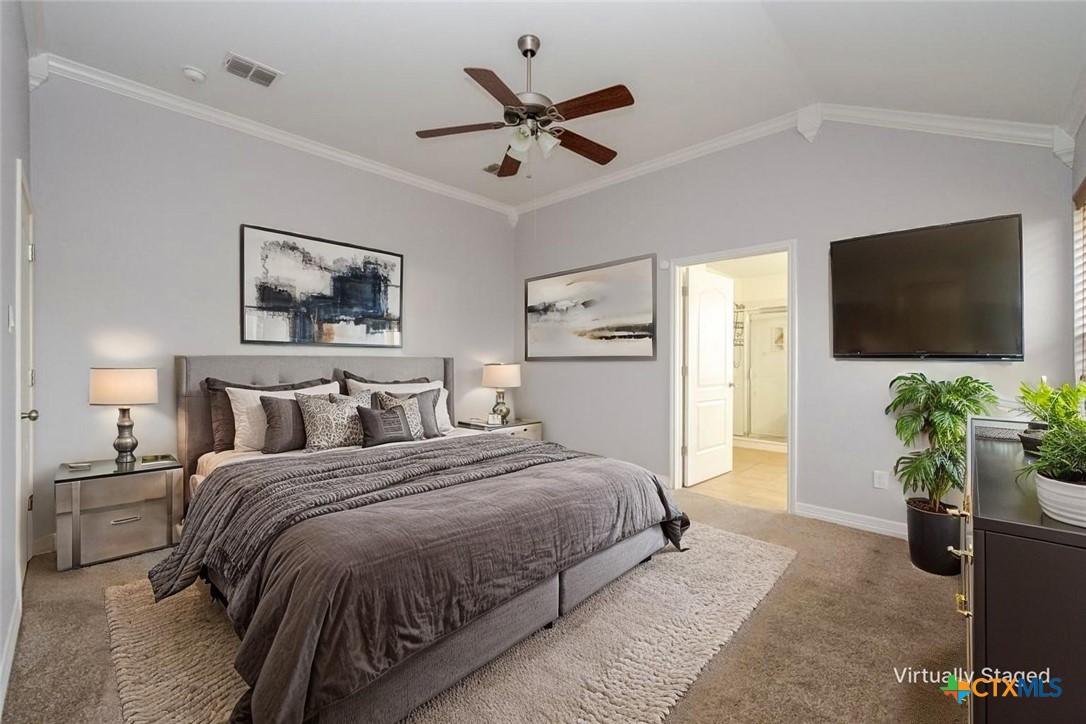 124 Prairie Circle Kempner, TX 76539 - Photo 9 of 34 a bedroom with a bed and a flat screen tv