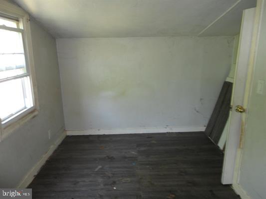 28 Main Street Bridgeton, NJ 08302 - Photo 12 of 29 an empty room with wooden floor and window