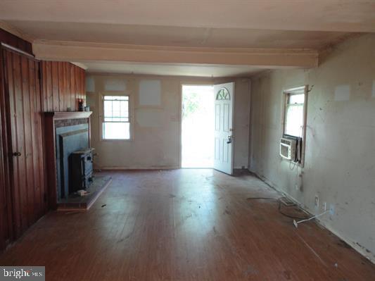 28 Main Street Bridgeton, NJ 08302 - Photo 7 of 29 a view of empty room with wooden floor and fan