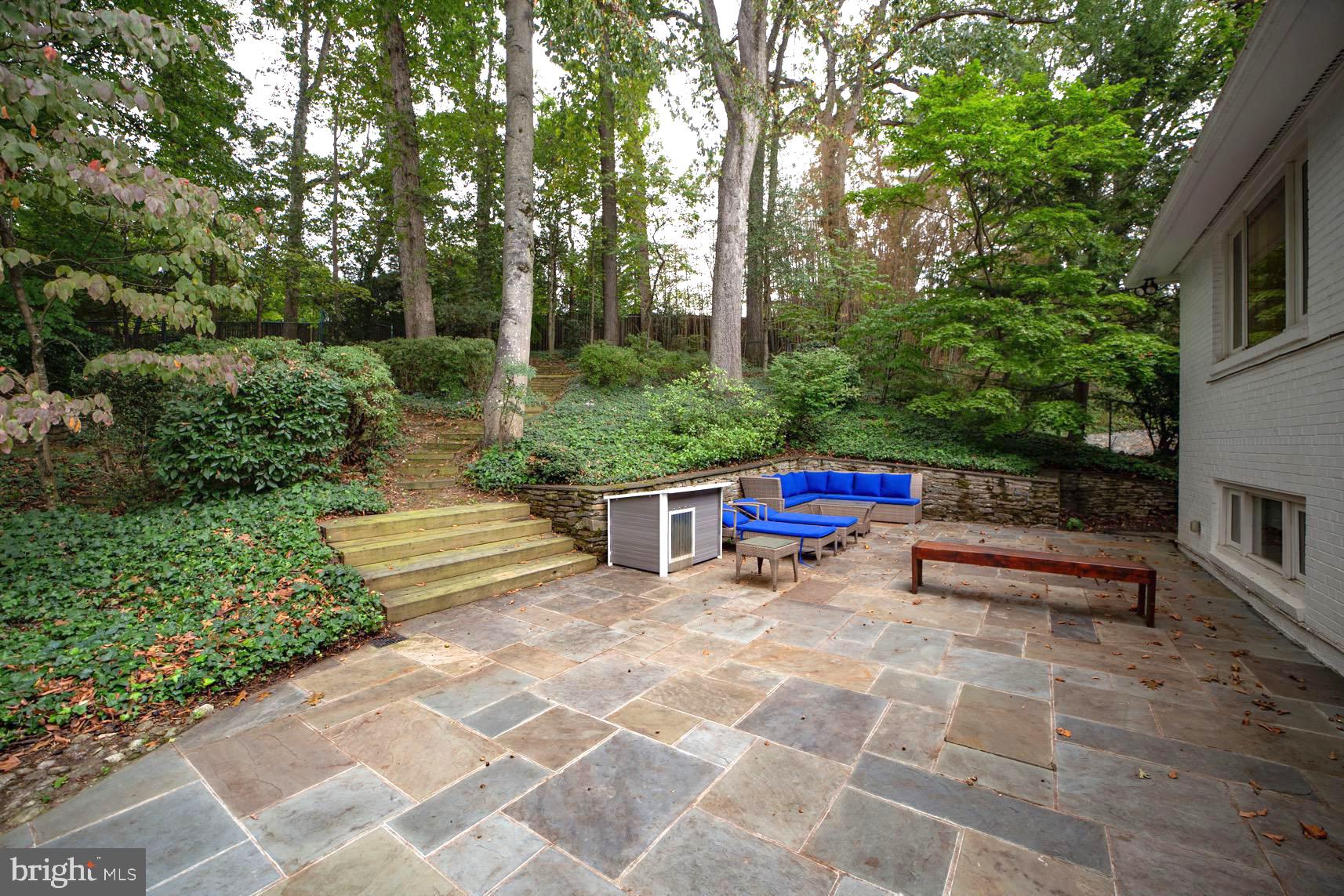 2824 Ellicott Street Northwest Washington, DC 20008 - Photo 23 of 47 a backyard of a house with outdoor seating