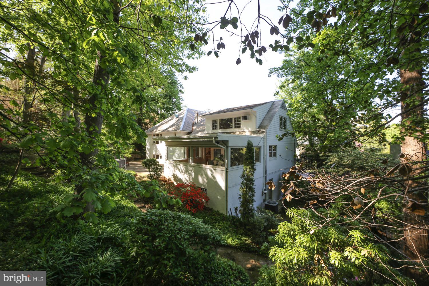 2824 Ellicott Street Northwest Washington, DC 20008 - Photo 27 of 47 a front view of a house with a tree