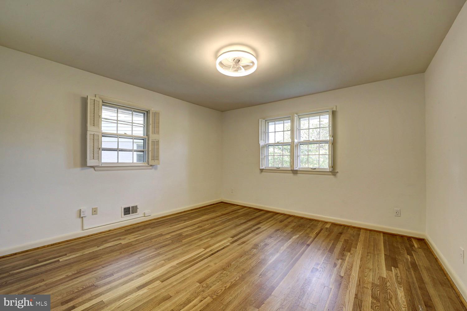 2824 Ellicott Street Northwest Washington, DC 20008 - Photo 37 of 47 wooden floor in an empty room with a window