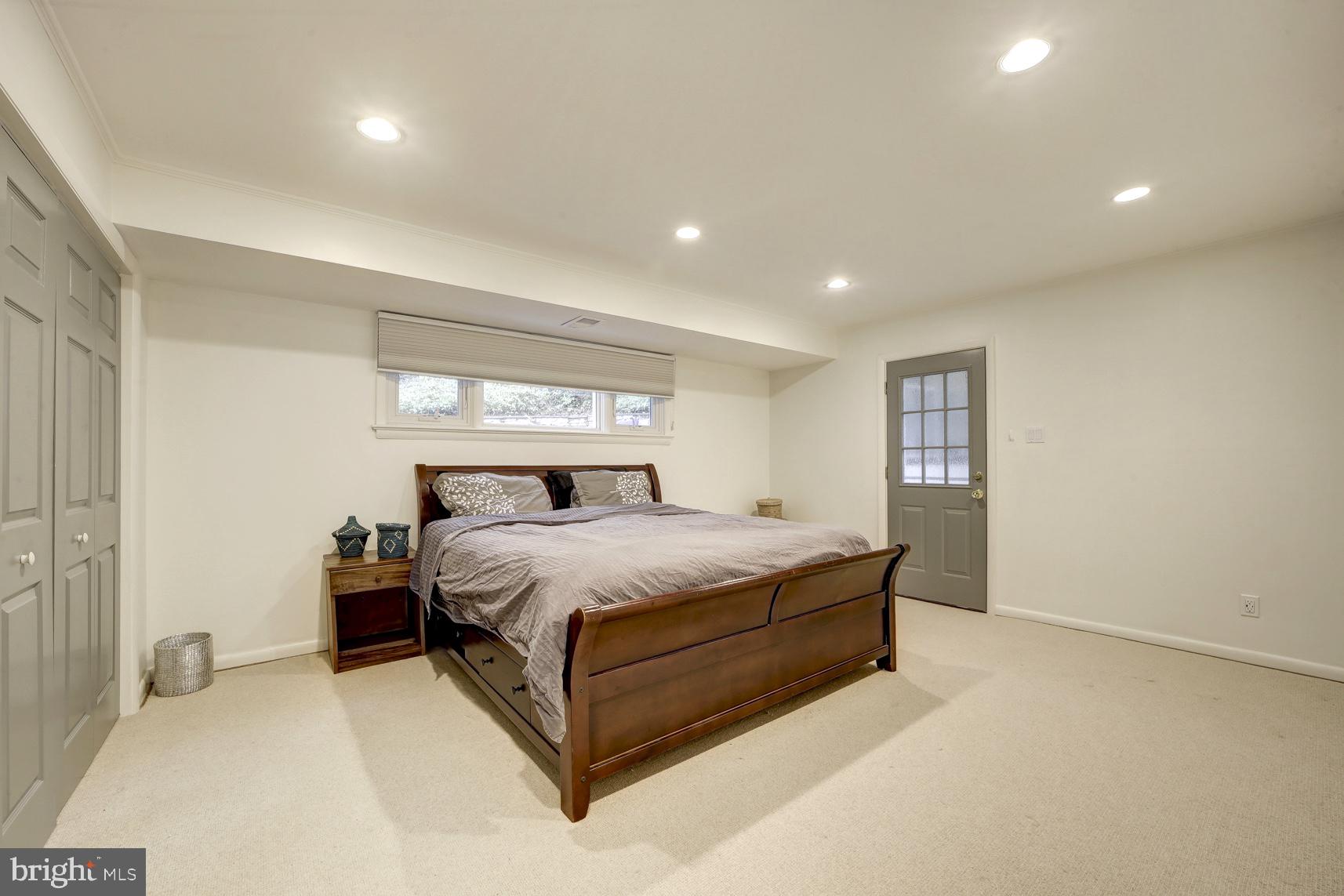 2824 Ellicott Street Northwest Washington, DC 20008 - Photo 45 of 47 a bedroom with a bed and window