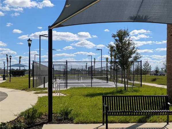 a aerial view of a house with a yard and garage