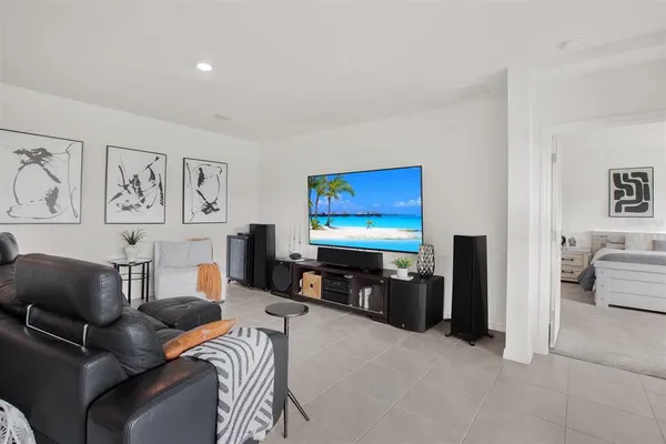 a bedroom with a bed and a couch