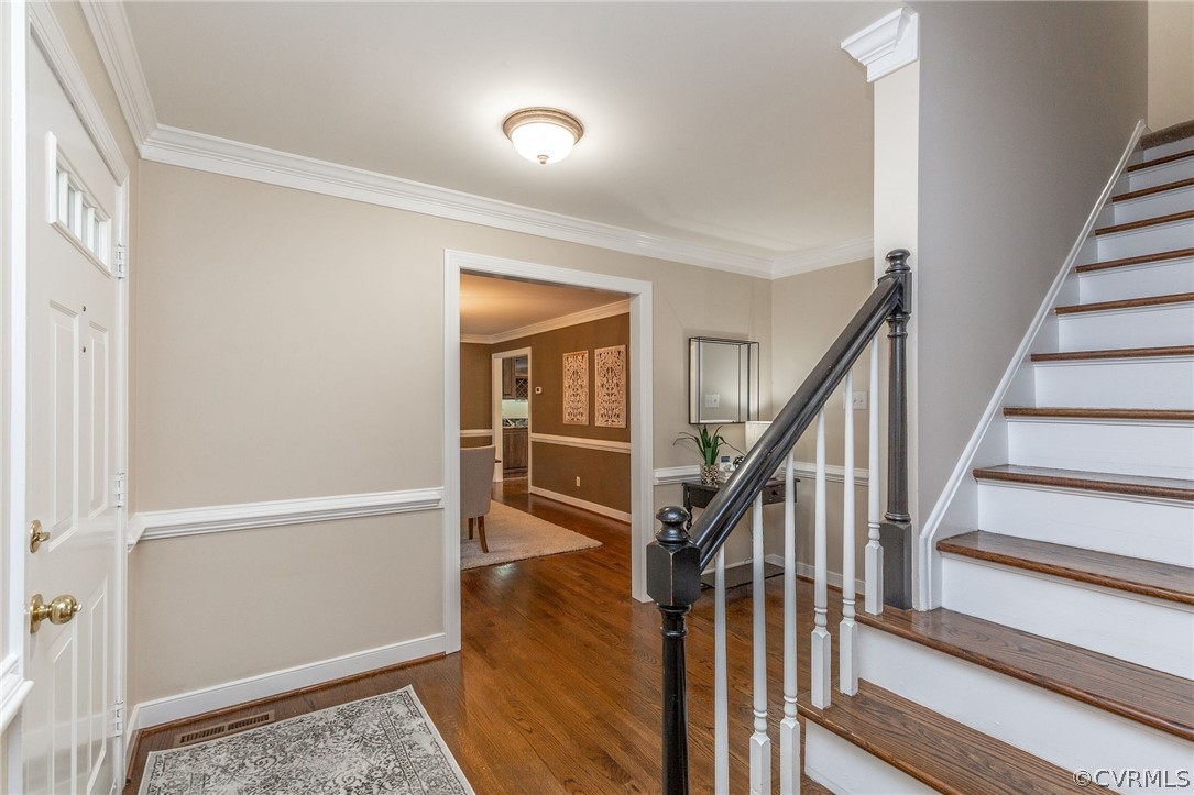 13031 Drakewood Road Midlothian, VA 23113 - Photo 4 of 41 a view of staircase with wooden floor and a rug