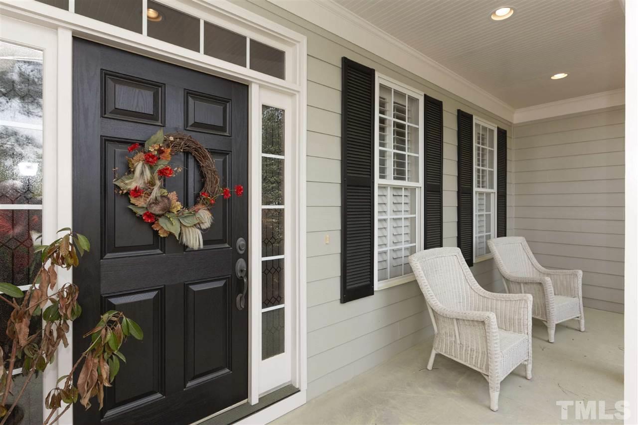 5804 Turner Store Lane Raleigh, NC 27603 - Photo 2 of 25 a view of a patio with dining table and chairs and a potted plant