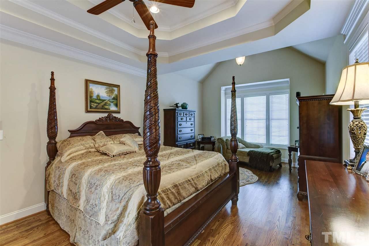 5804 Turner Store Lane Raleigh, NC 27603 - Photo 11 of 25 a bedroom with bed and a window