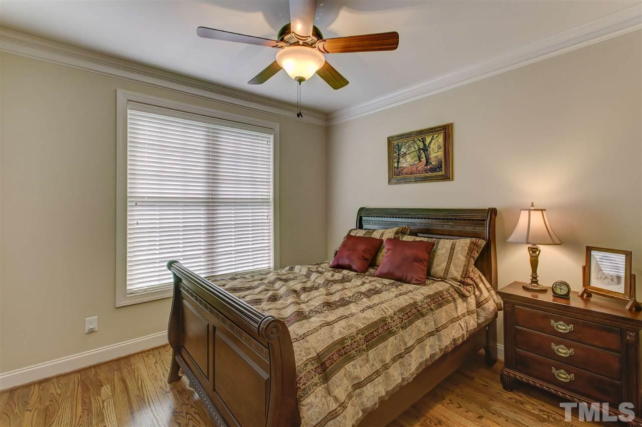 5804 Turner Store Lane Raleigh, NC 27603 - Photo 13 of 25 a bedroom with a bed and a window
