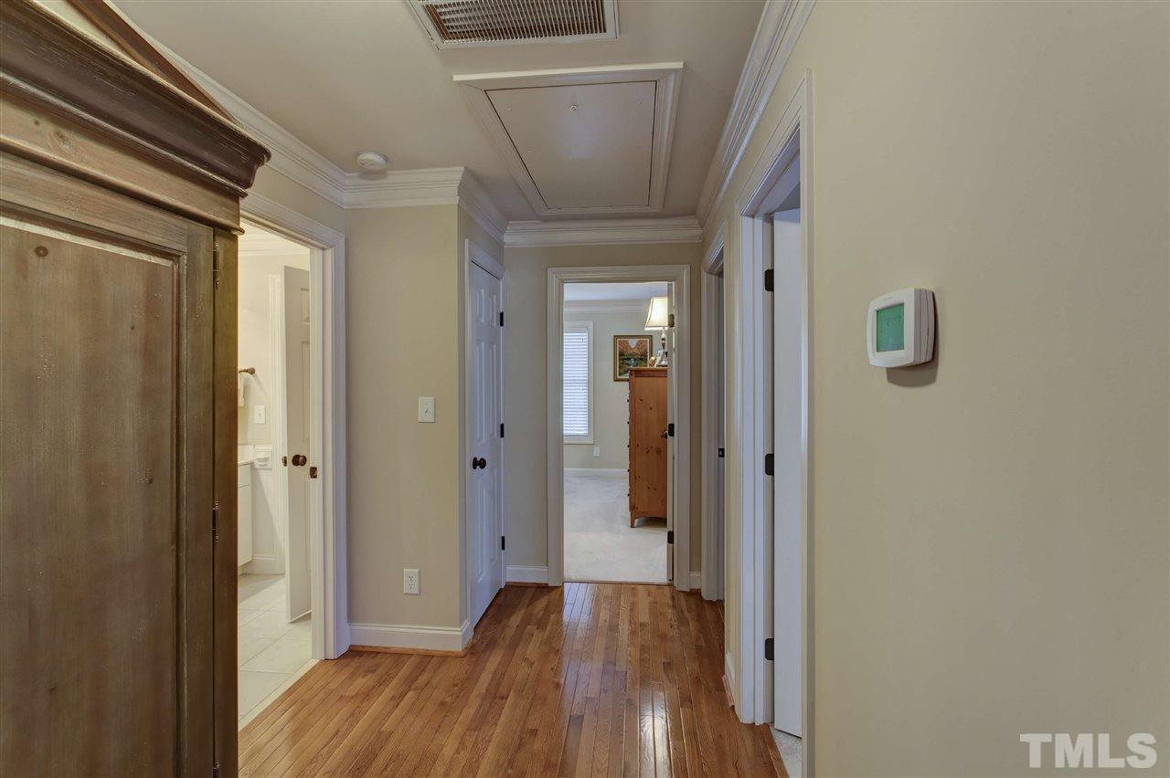 5804 Turner Store Lane Raleigh, NC 27603 - Photo 17 of 25 a view of a hallway with wooden floor