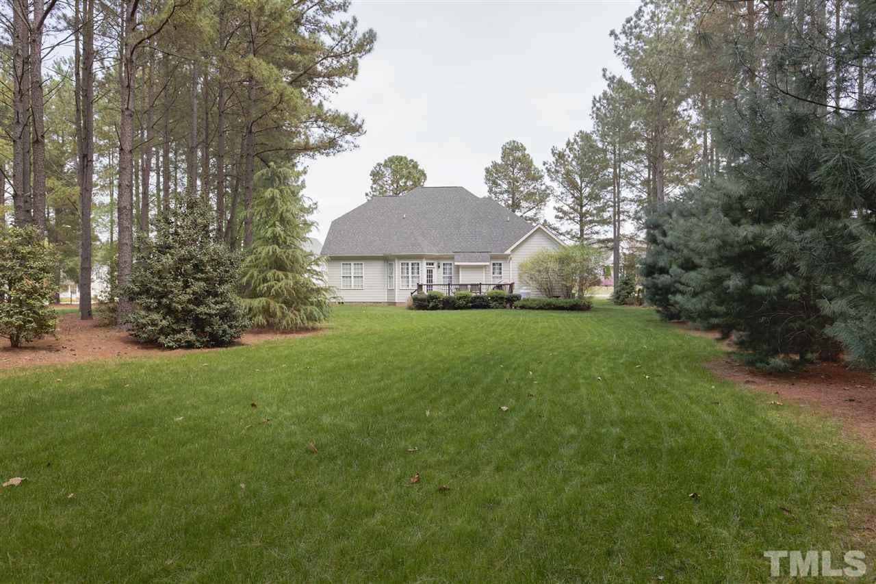 5804 Turner Store Lane Raleigh, NC 27603 - Photo 22 of 25 a view of a house with a yard