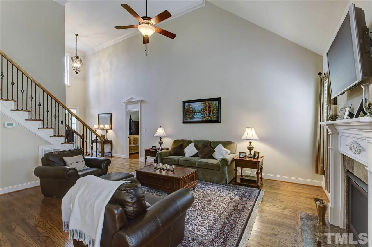 5804 Turner Store Lane Raleigh, NC 27603 - Photo 5 of 25 a living room with furniture fireplace and a rug